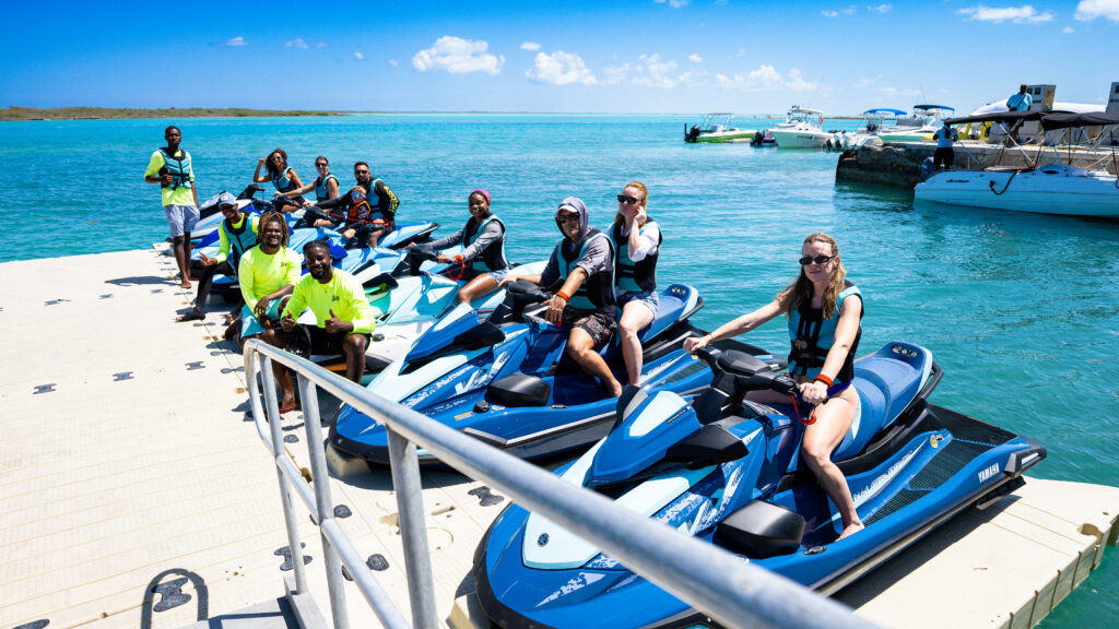 Group of riders lined up on Jet Wave Turks jet skis at the dock in Providenciales