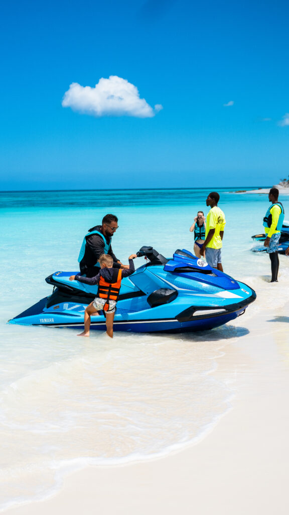 Jet Wave Turks guide helping a rider get started on a jet ski