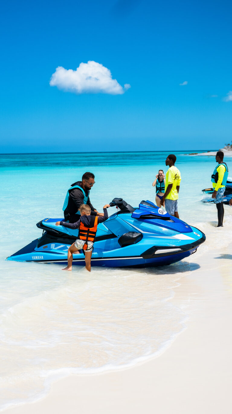 Jet Wave Turks guide helping a rider get started on a jet ski